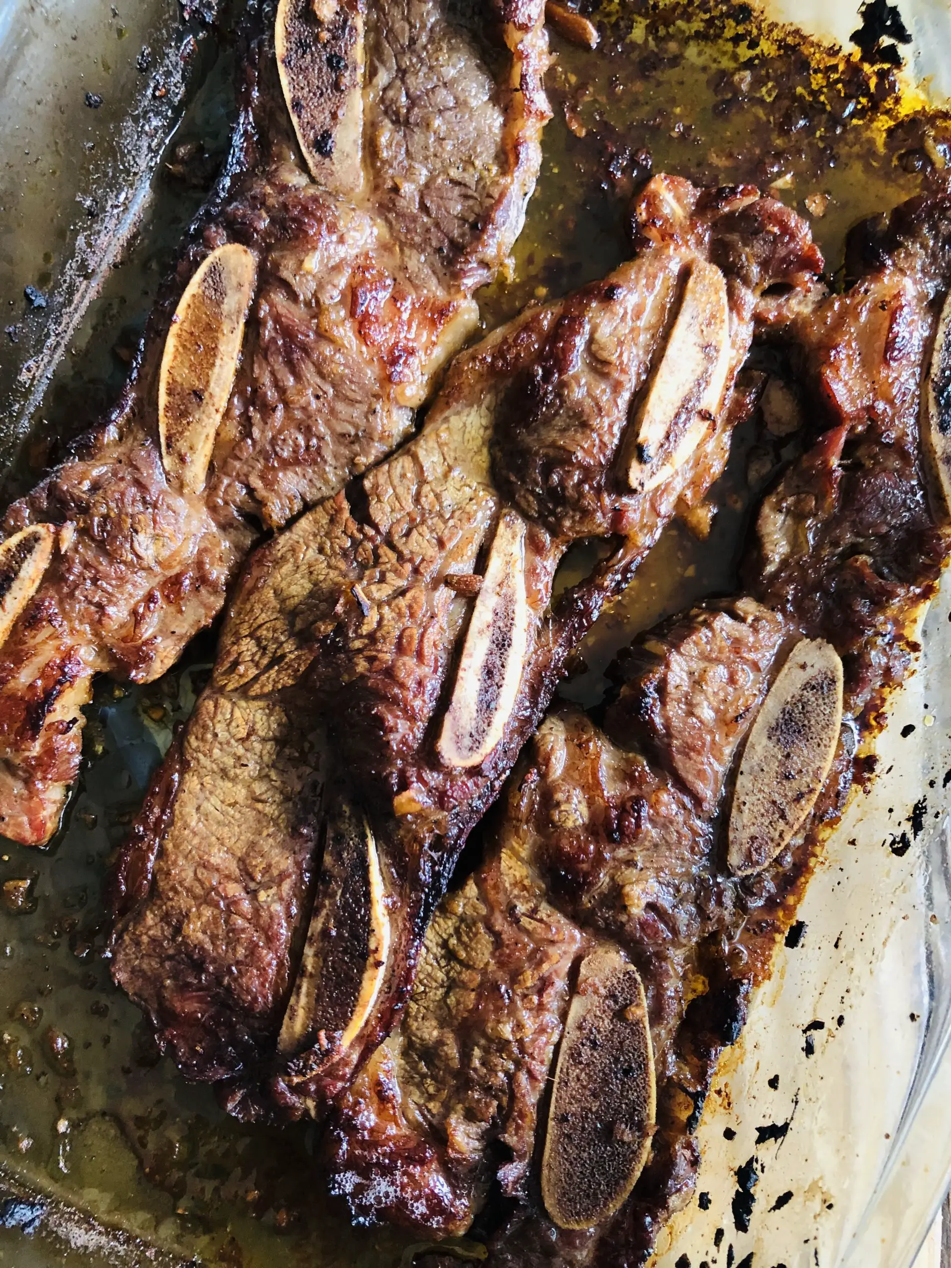 Korean Short Ribs in a glass dish that have just been baked