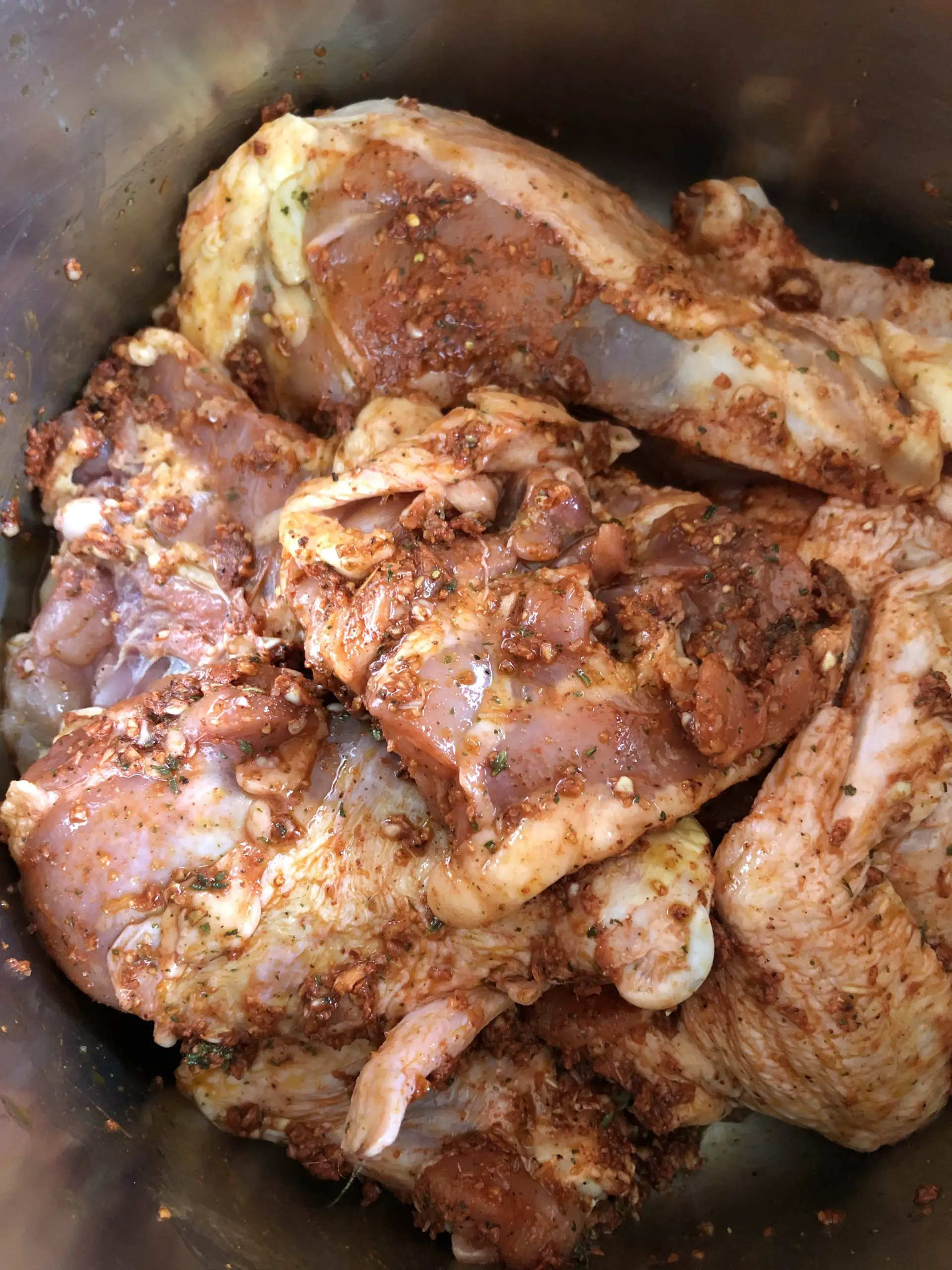 pieces of chicken in a marinade