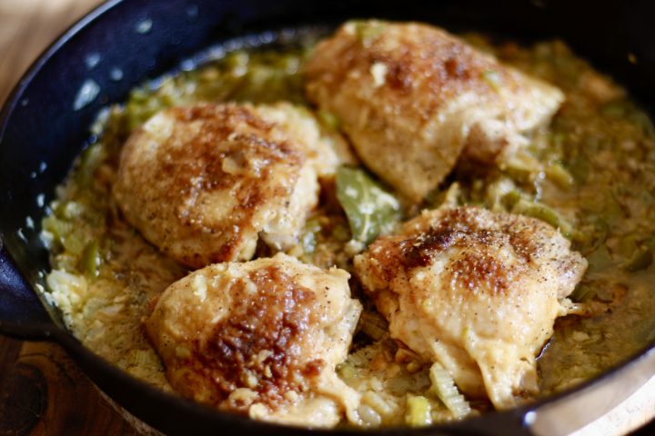 Cajun Smothered Chicken in a cast iron pan
