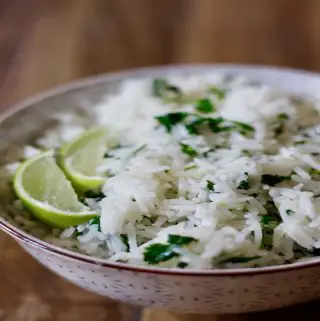 Cilantro Lime Rice in a bowl with limes