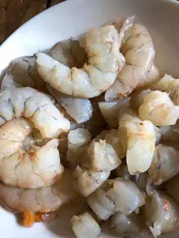Peeled and deveined shrimp in a white bowl