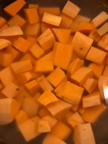 Cubes of sweet potatoes in water.