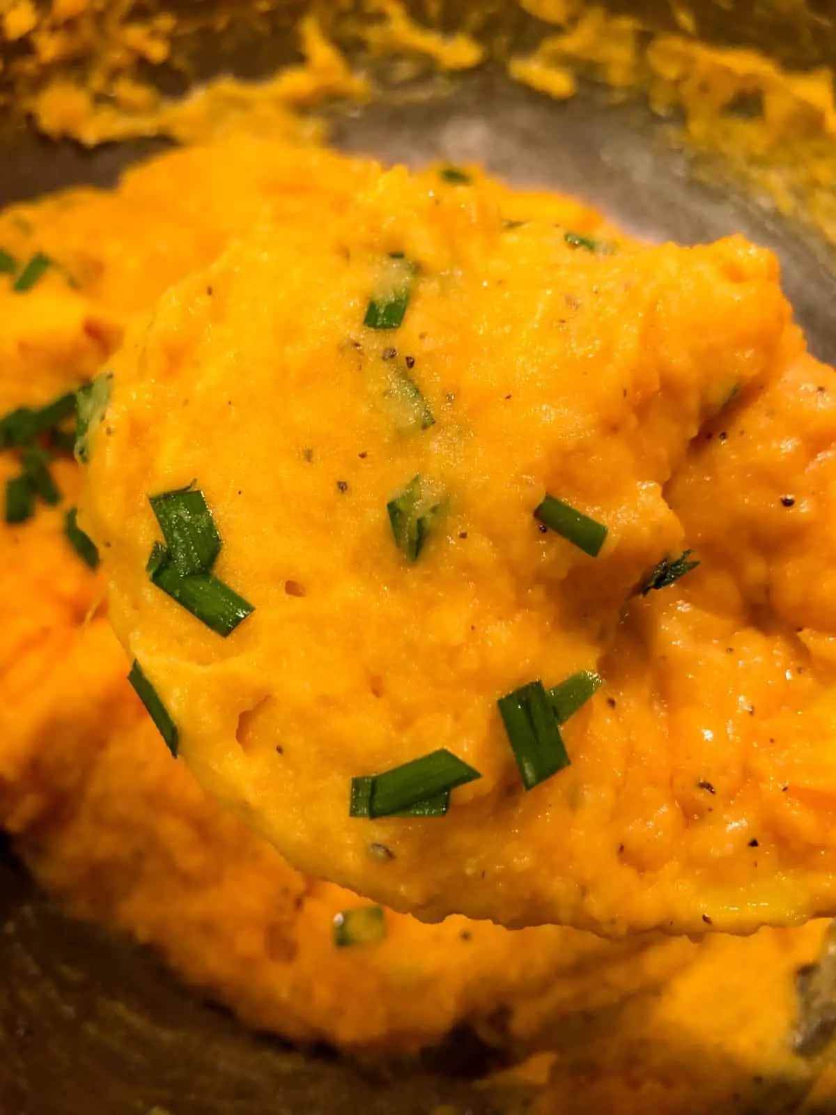 Creamy mashed sweet potatoes with chives.