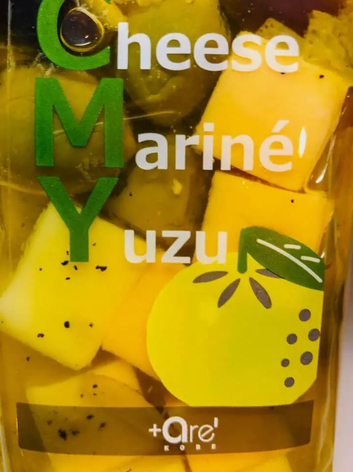 A package of cheese cubes marinated with yuzu. 