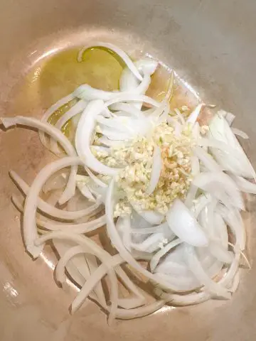 Sliced onion and minced garlic in olive oil in a dutch oven.