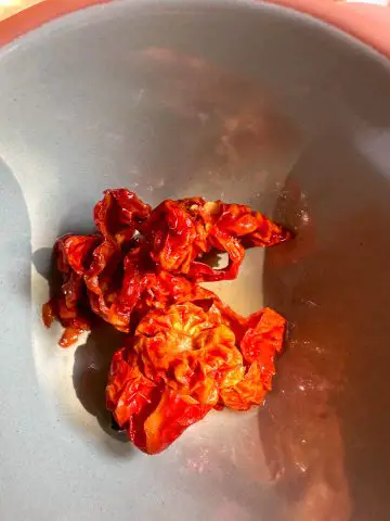 Sliced pieces of Ghost chilies in a bowl.