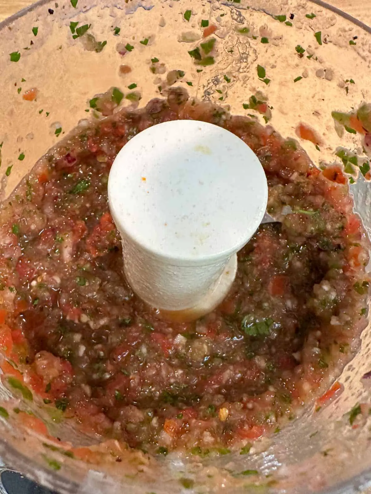 A food processor containing Ghost pepper salsa.