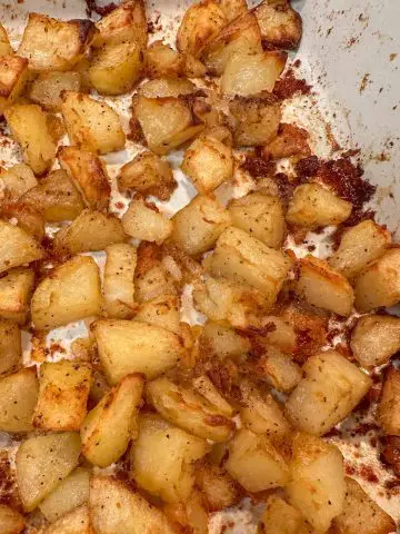 Oven crispy roasted potatoes in a dish.