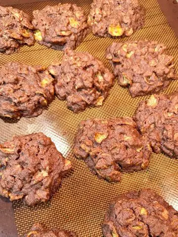 Easy New Zealand Afghan Cornflake Cookies on a silicone baking mat.