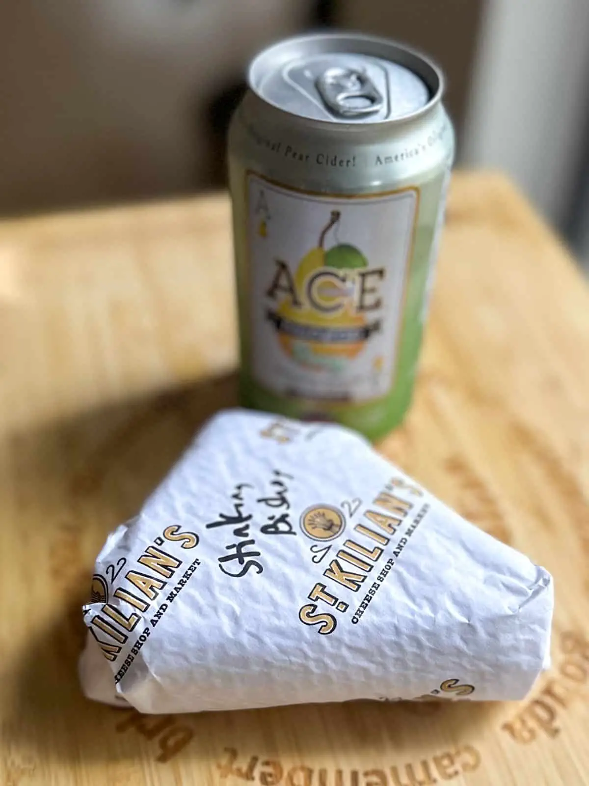 A can of Ace Perry Cider and a wrapped piece of Stinking Bishop cheese from St. Kilian's Cheese Shop.
