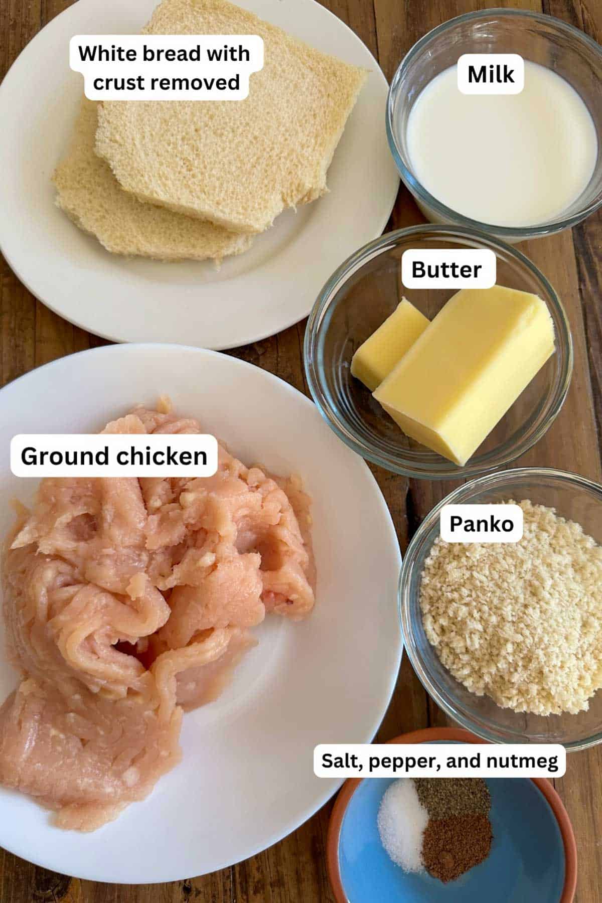Ingredients for ground chicken cutlets displayed including white bread slices with crust removed, ground chicken, milk, butter, panko, and salt, pepper, and nutmeg.